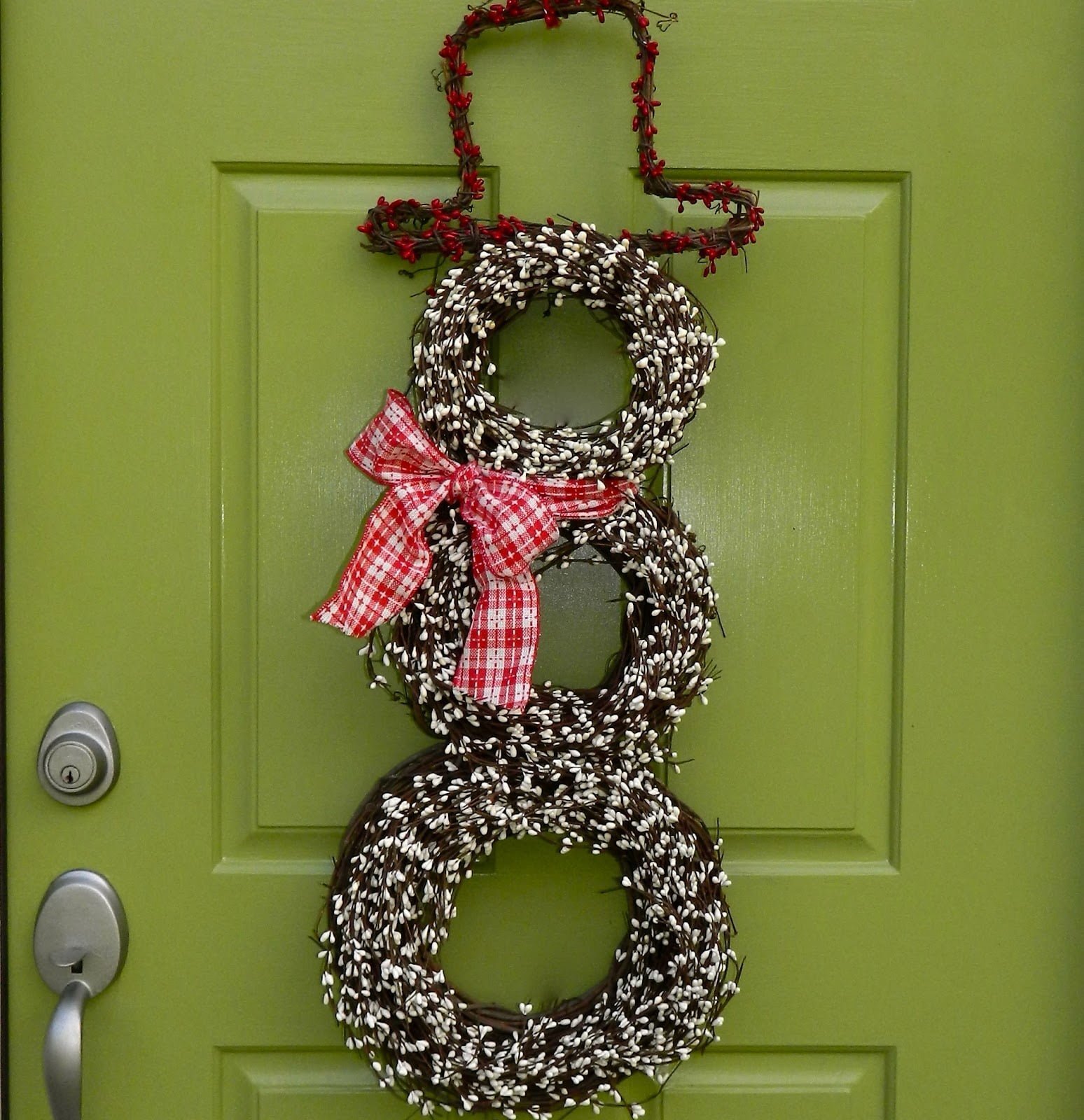 A Mini Holiday Snowman Made Of Wreaths