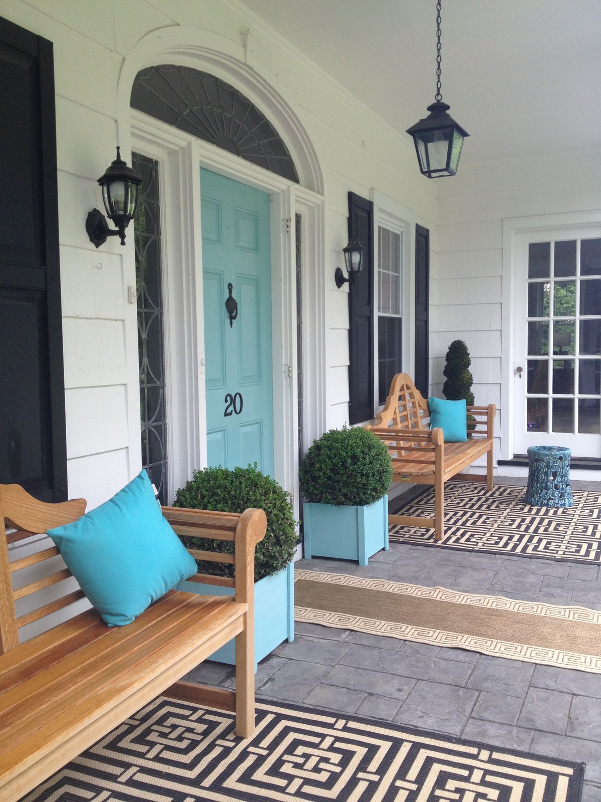 Blue Pillows Perfectly Coordinate With a Cool Blue Door