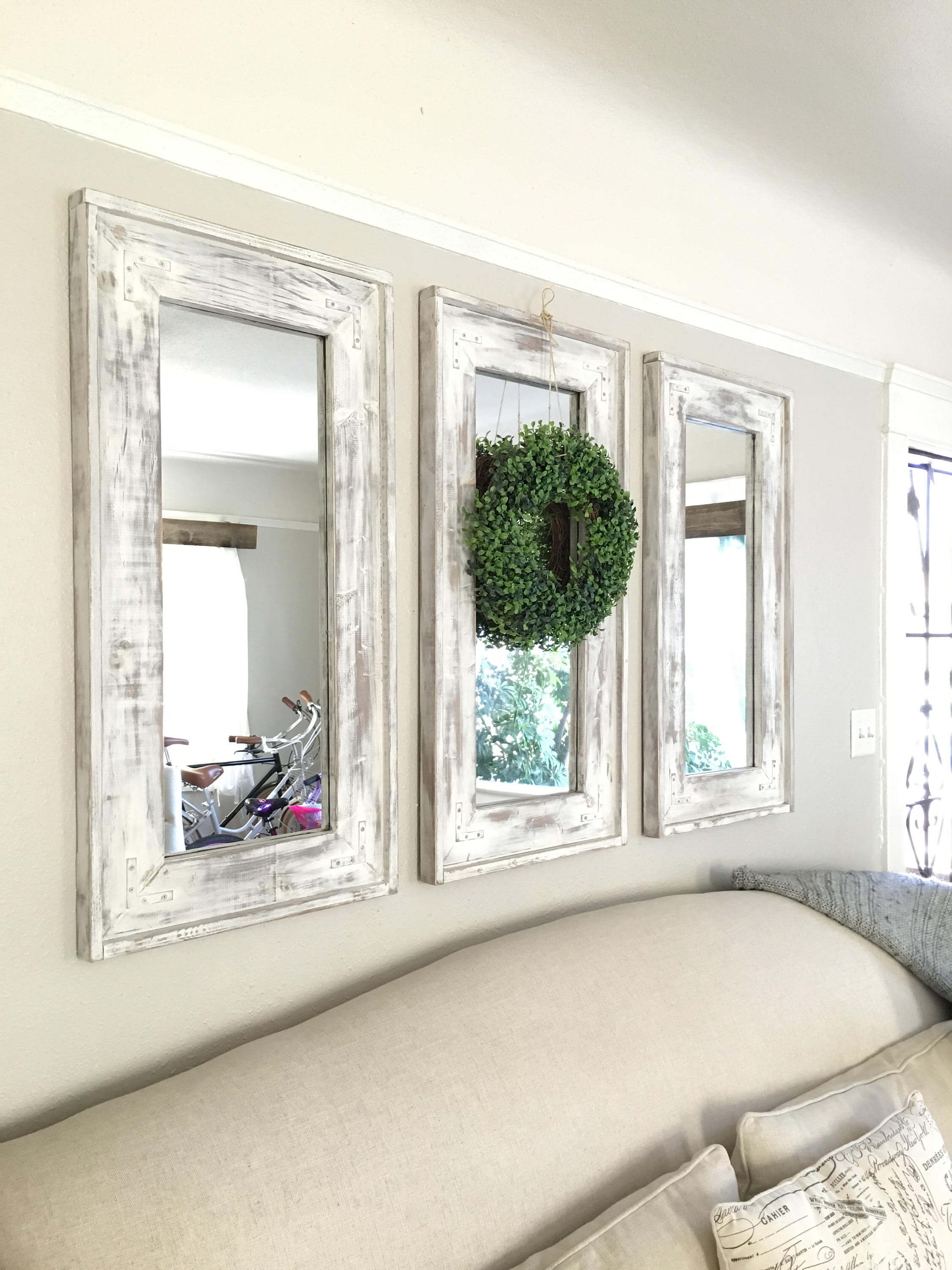 Triad of Narrow Whitewashed Mirrors Accented with Eucalyptus Wreath