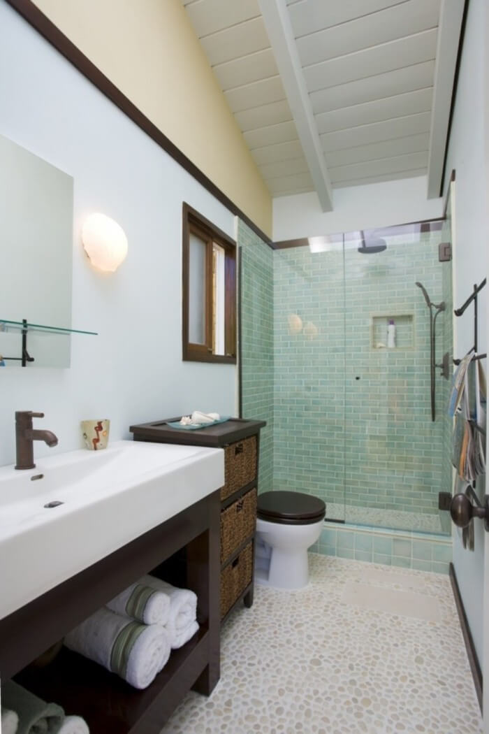 Pebble Tile Floor Paired with Aqua Shower Walls