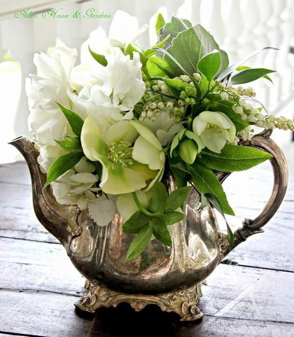 Silver Teapot with Green and White Arrangement