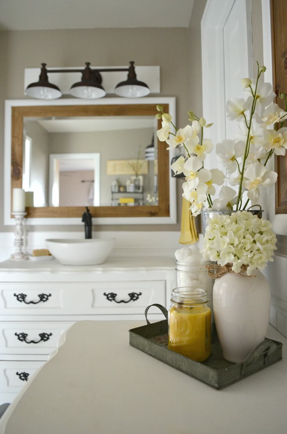 Bright Farmhouse Bathroom with Wood and Flowers