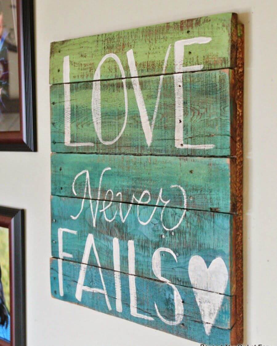 Painted Pallet Love Never Fails Sign