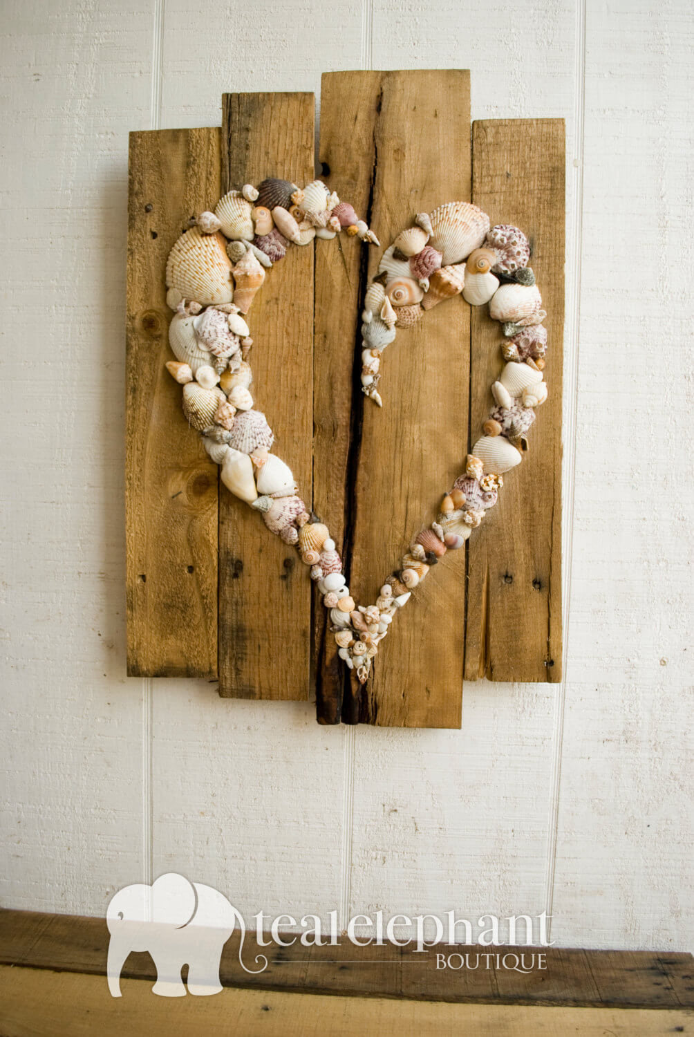 Heart-Shaped Shell Design on a Driftwood Background