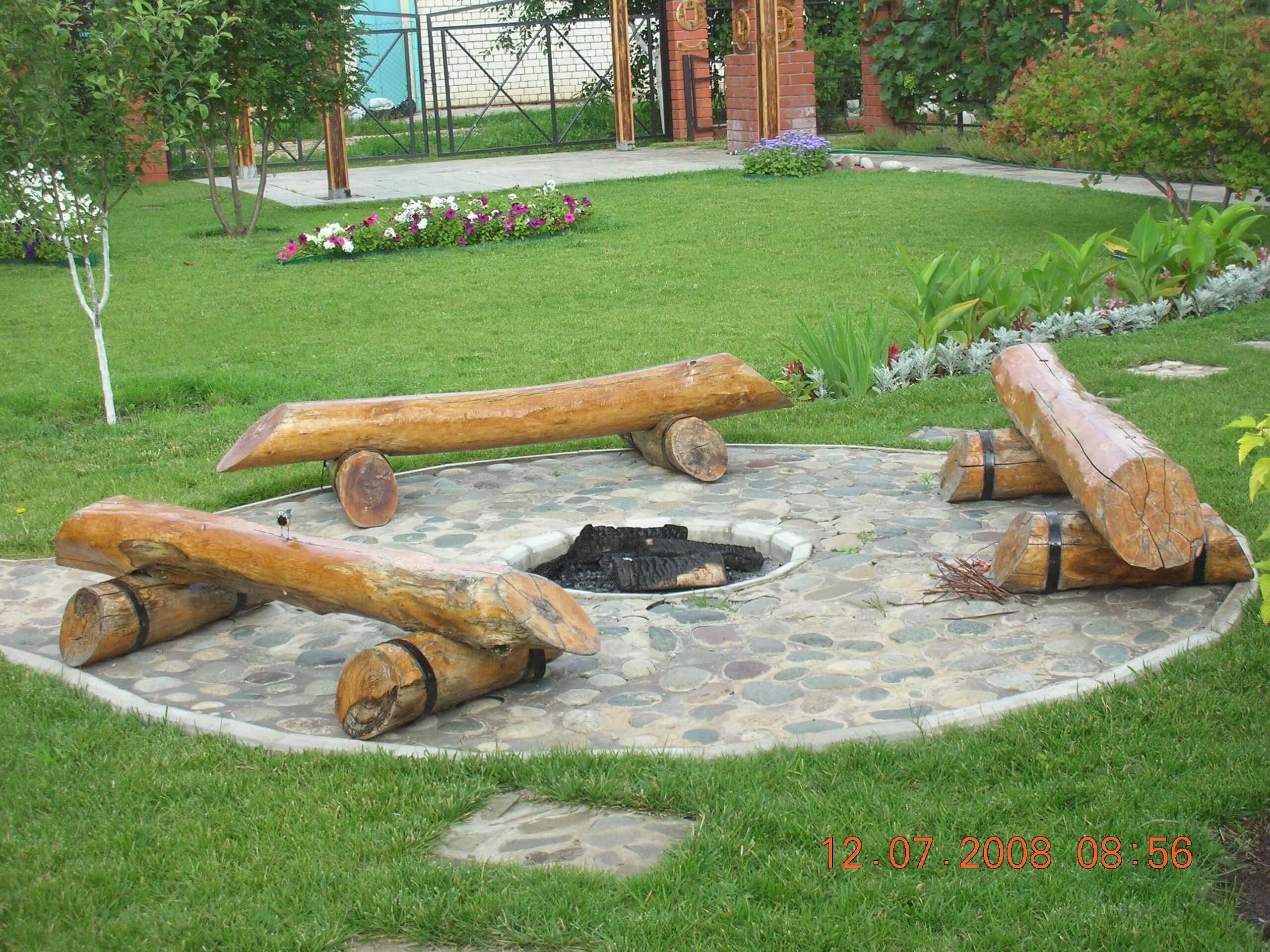 Log Benches Surrounding a Pit in Stone