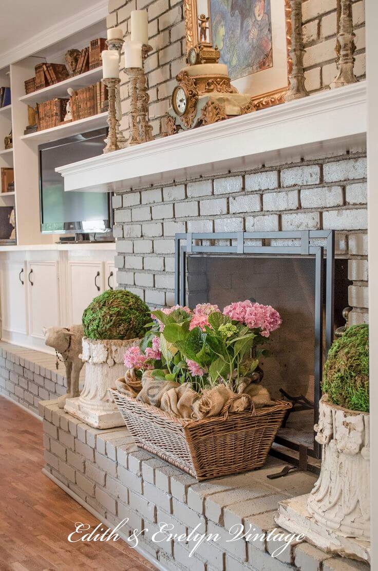 Grey Brick Fireplace with Potted Spring Flowers