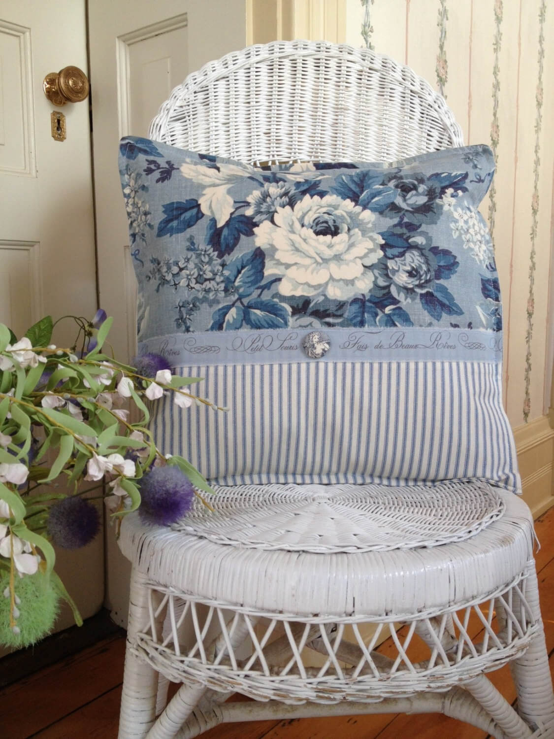 White Wicker Chair with Blue Toile Pillow