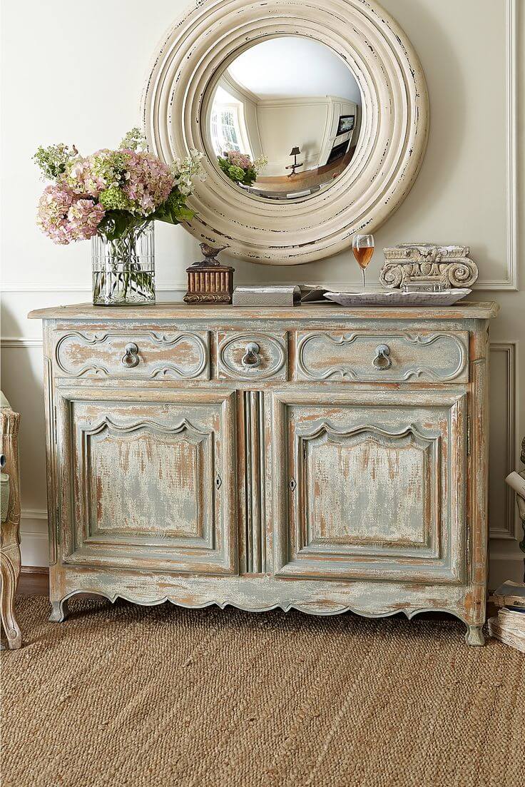 Antiqued Credenza and Rustic Round Mirror