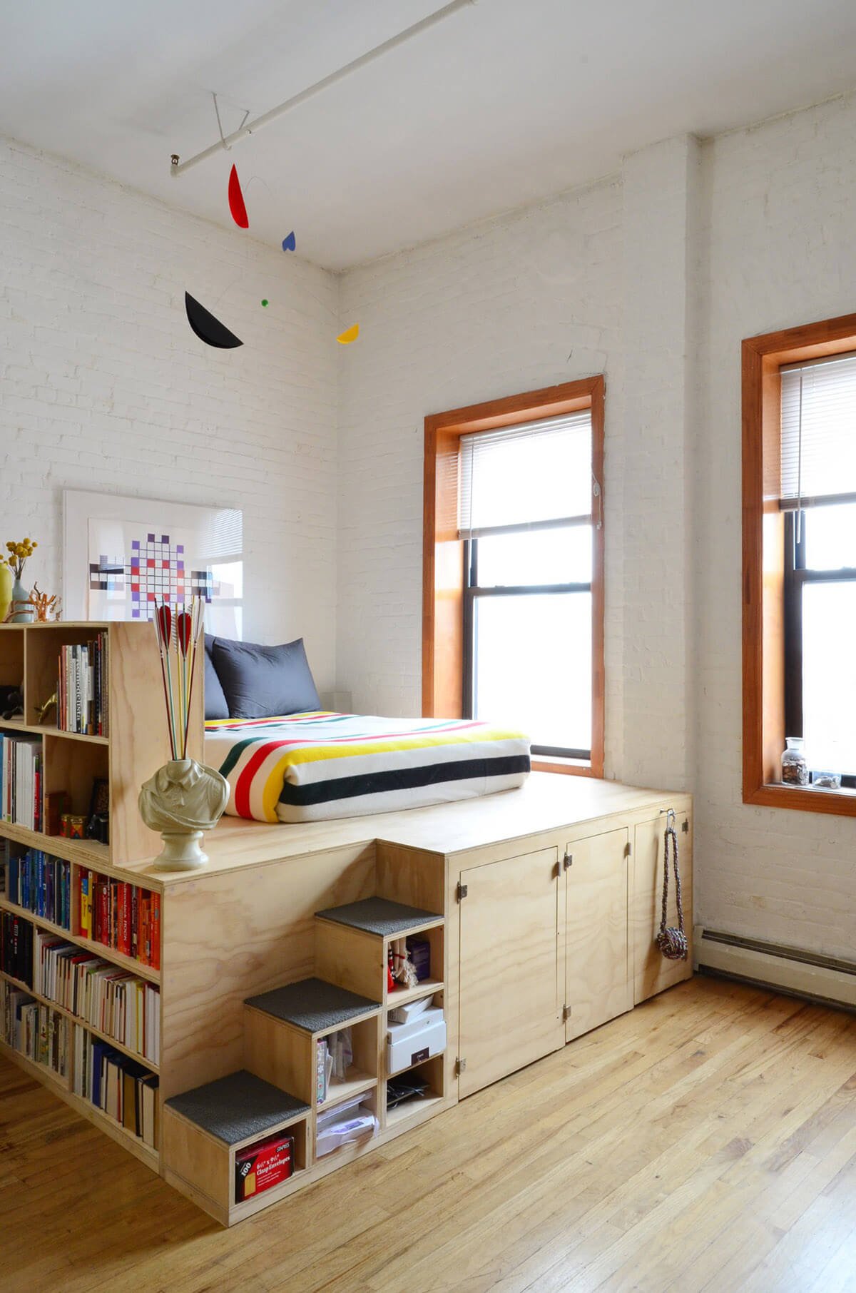 An Elevated Bed with Shelving and Storage