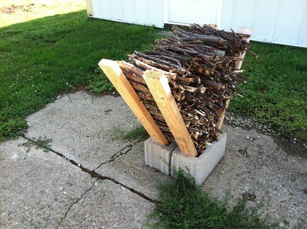 A V-Shaped Wood Rack Stabilized with Cinderblocks