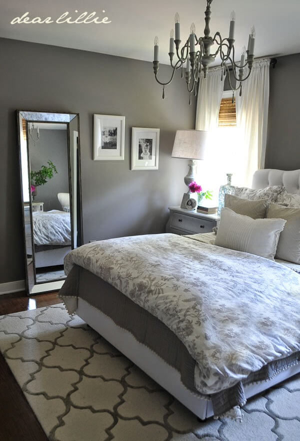 Charming Patterns and Fresh White Accents Adorn a Solid Grey Base Bedroom