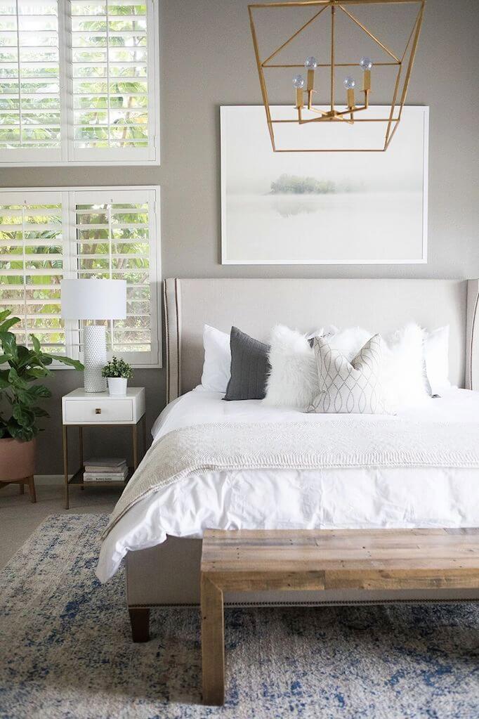 Deconstructed Chic Meets Soft Linens on a Minimalist Grey Bedroom