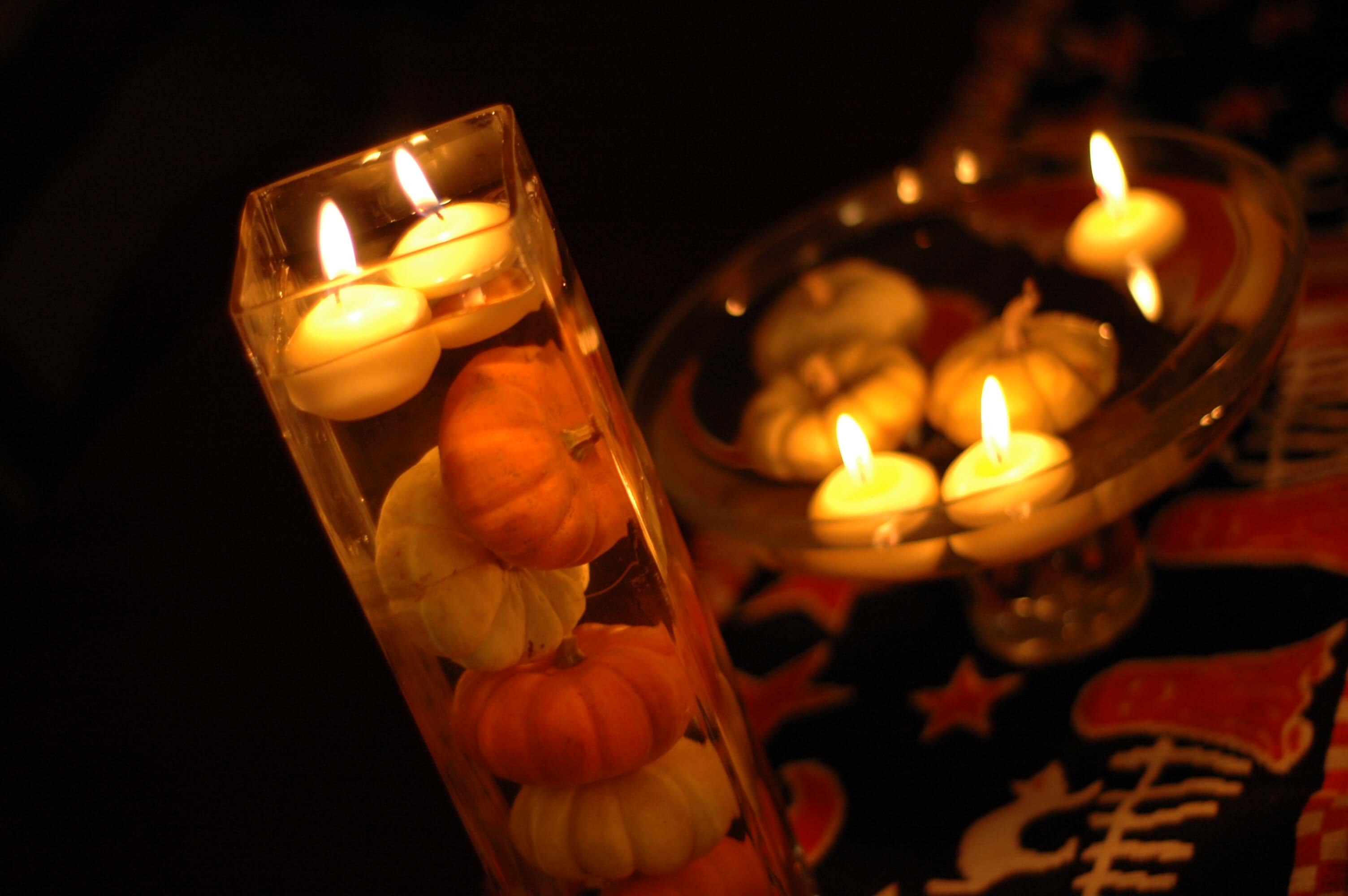 Candles Floating Amidst and Above the Pumpkins