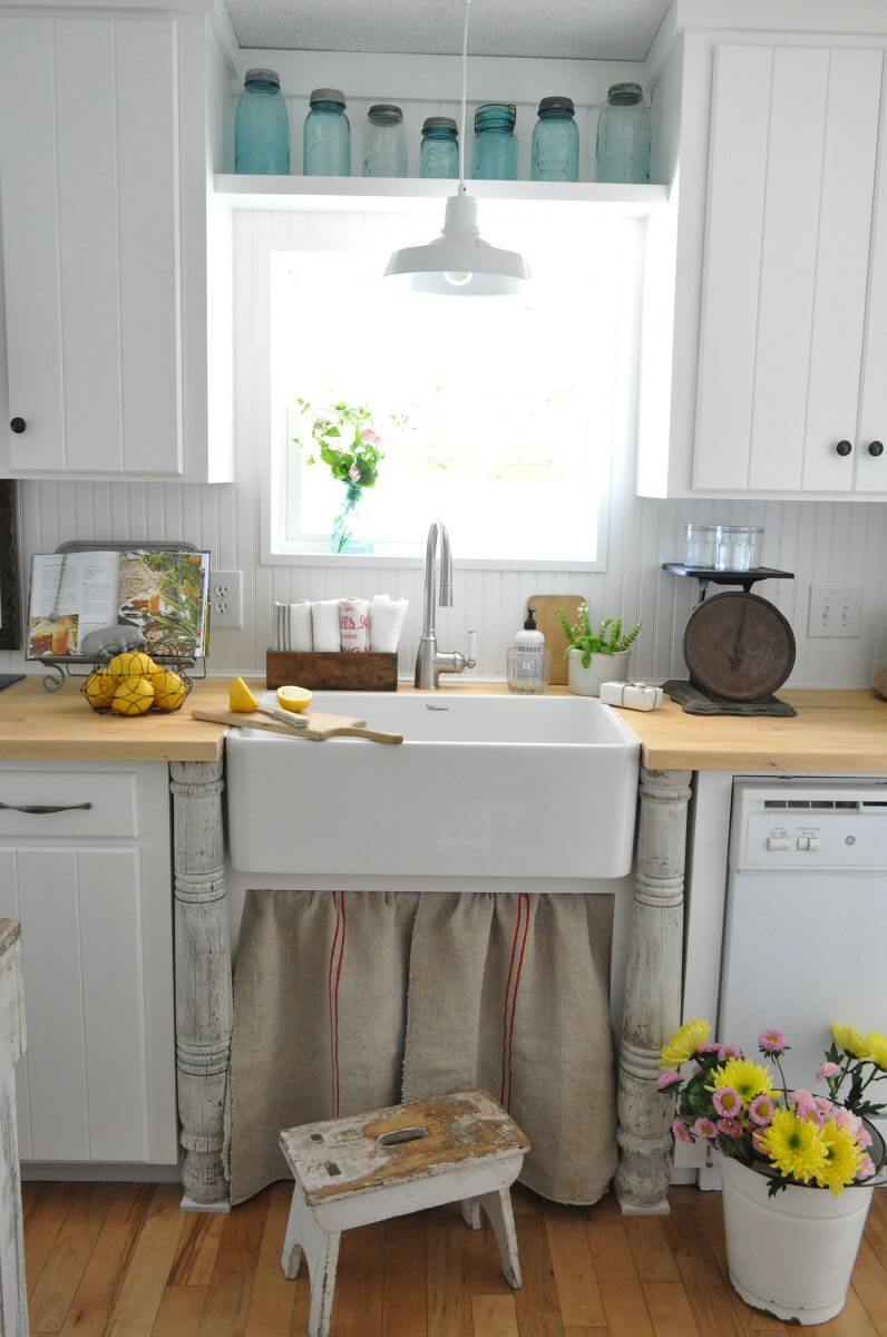 Simple Paneled White Cabinets with Black Hardware