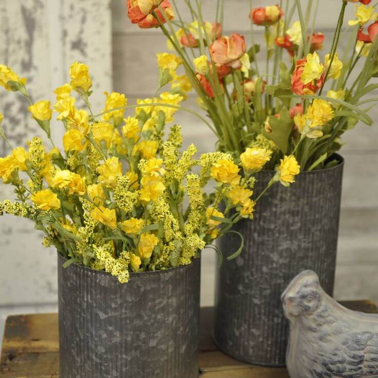 Yellow and Orange Flowers in Metal Cans