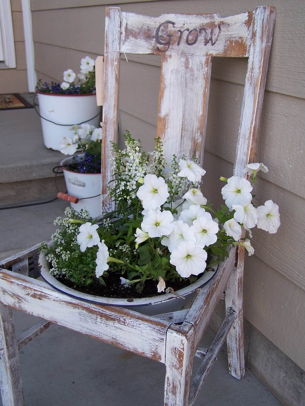 Distressed Wooden Chair With Potted Flower Arrangements