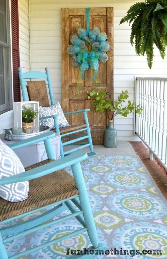 Turquoise Rocking Chairs, Patterned Rug, Billowy Wreath