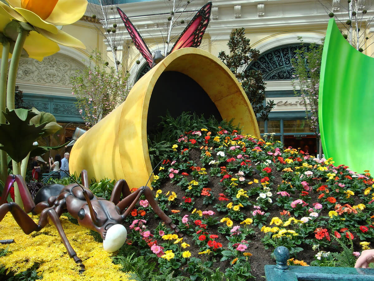 Garden with Oversized Insects and Tiny Flowers