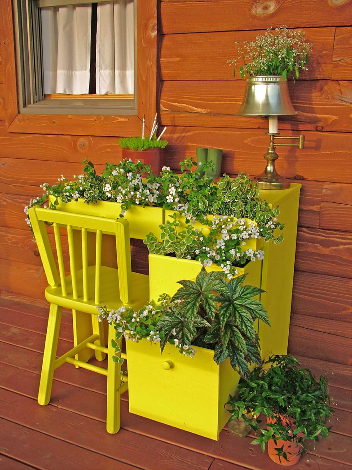 Bright Yellow Desk with Greens and Flowers