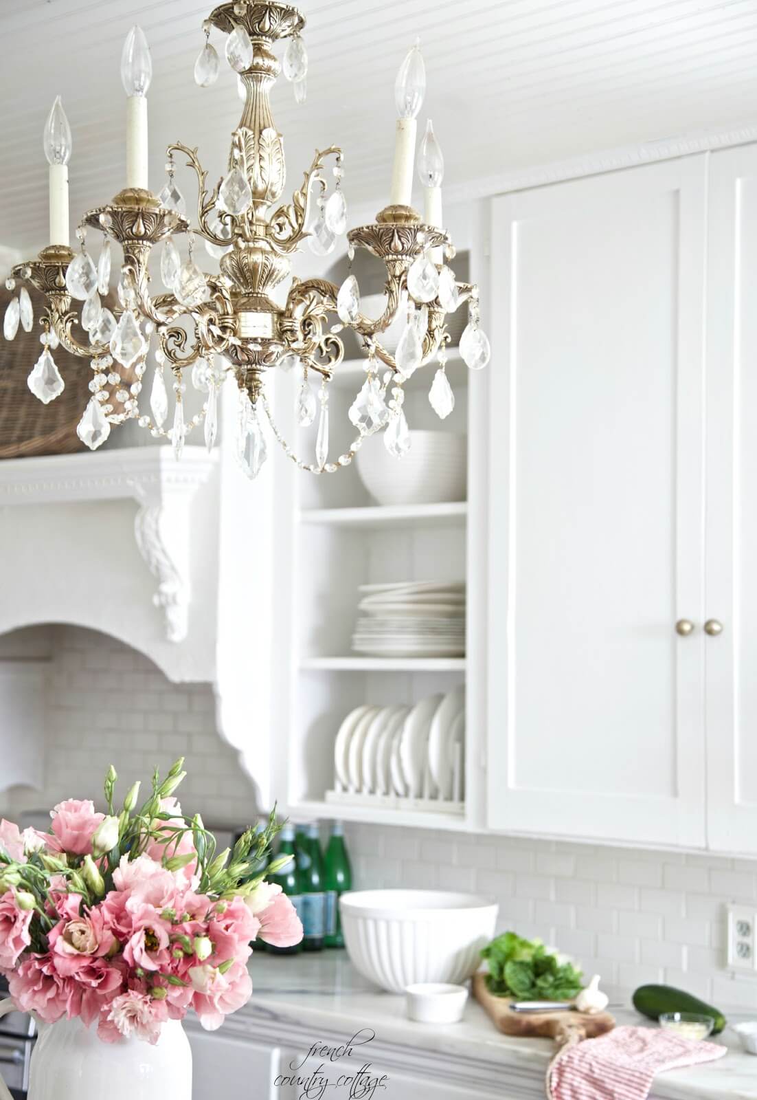 Silver and Crystal Chandelier with Wooden Cabinets