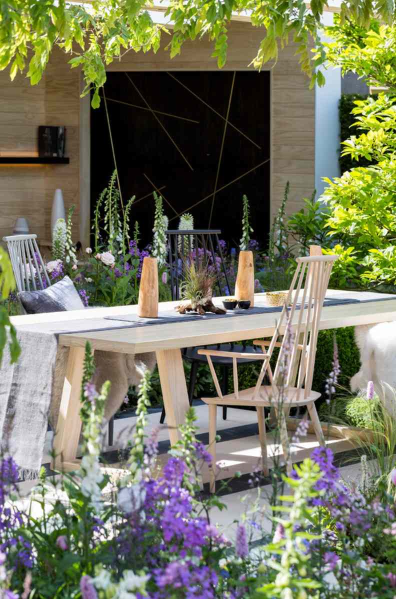 Elegant Dining Table Surrounded by Flowers