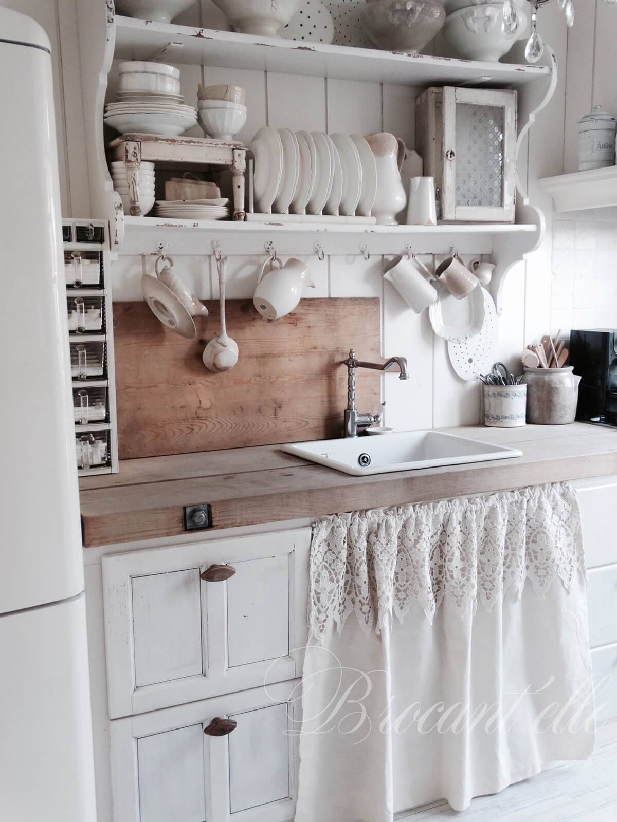 Lace Curtain Covering Shelves under the Sink