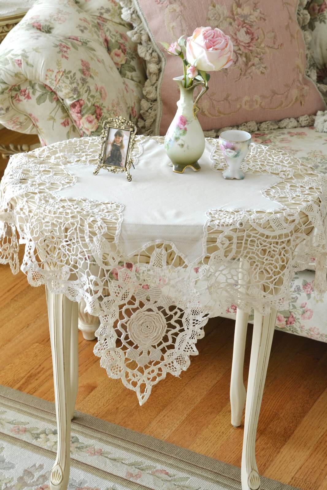 White Cutwork Doilies with Bud Vase