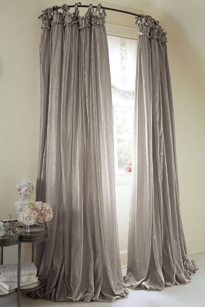 Dramatic Windows with Draped Curtains