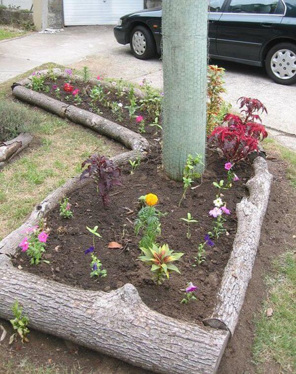 Natural Logs Around Raised Flower Bed