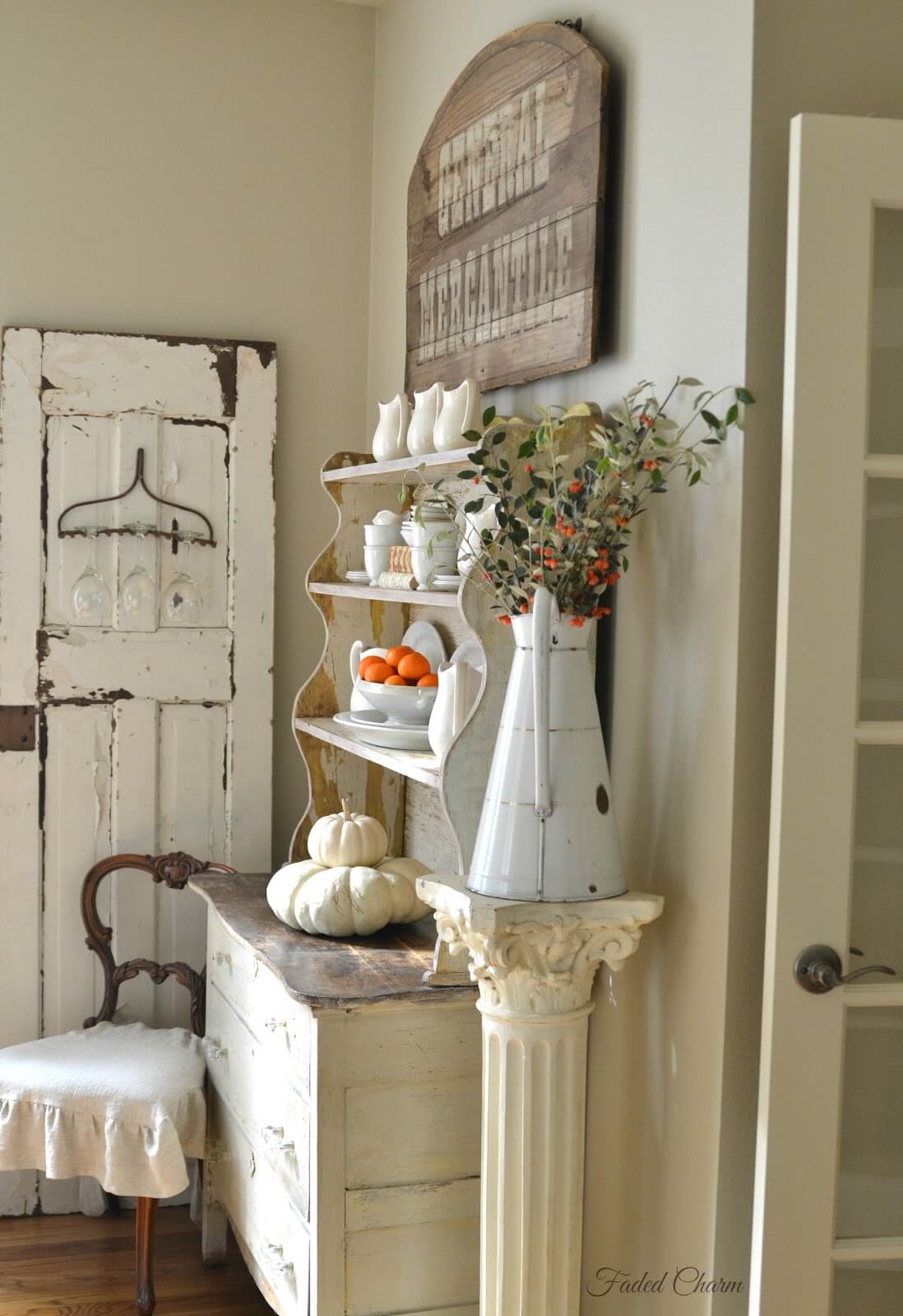 Distressed Metal Pitcher on a Pedestal