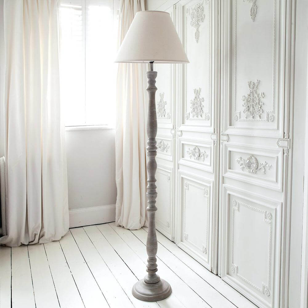 Graceful Pedestal Lamp in a White Room