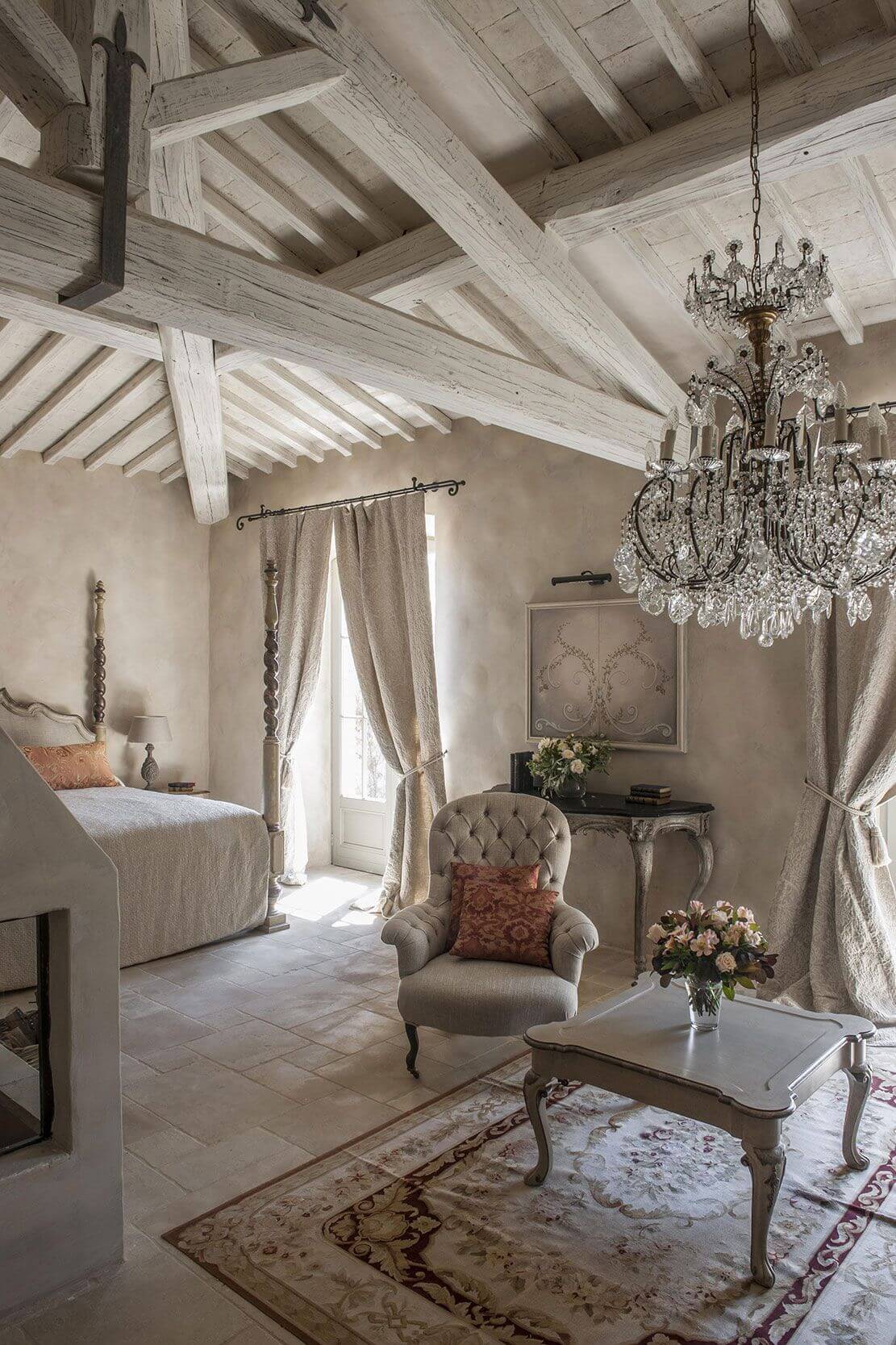 Ornate Chandelier and a Tufted Chair