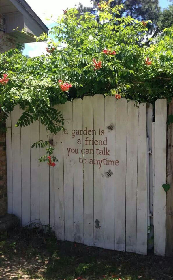 Stenciled Message on a Whitewashed Garden Gate