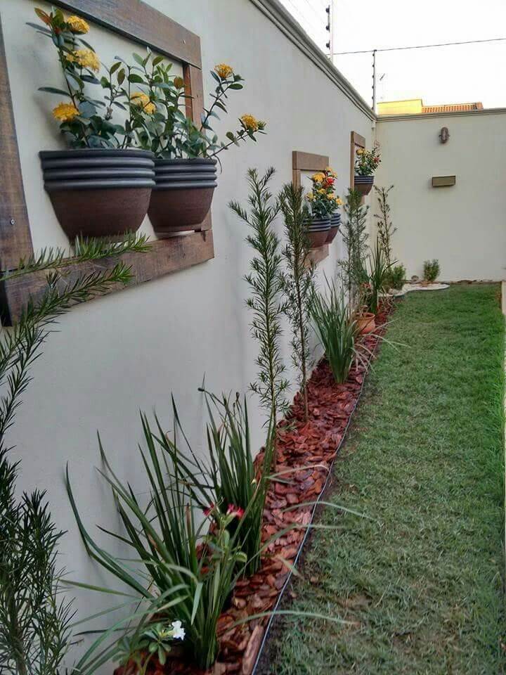 Half Planters Hung in Frames on the Fence