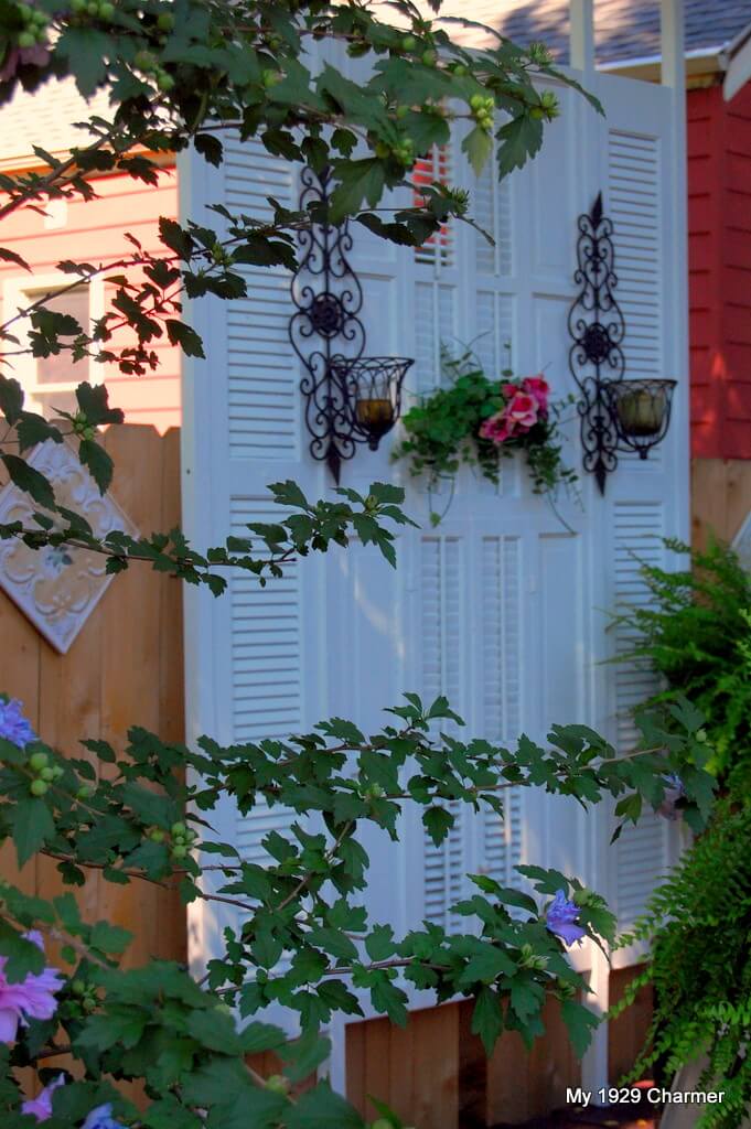 Graceful Garden Wall with Sconces