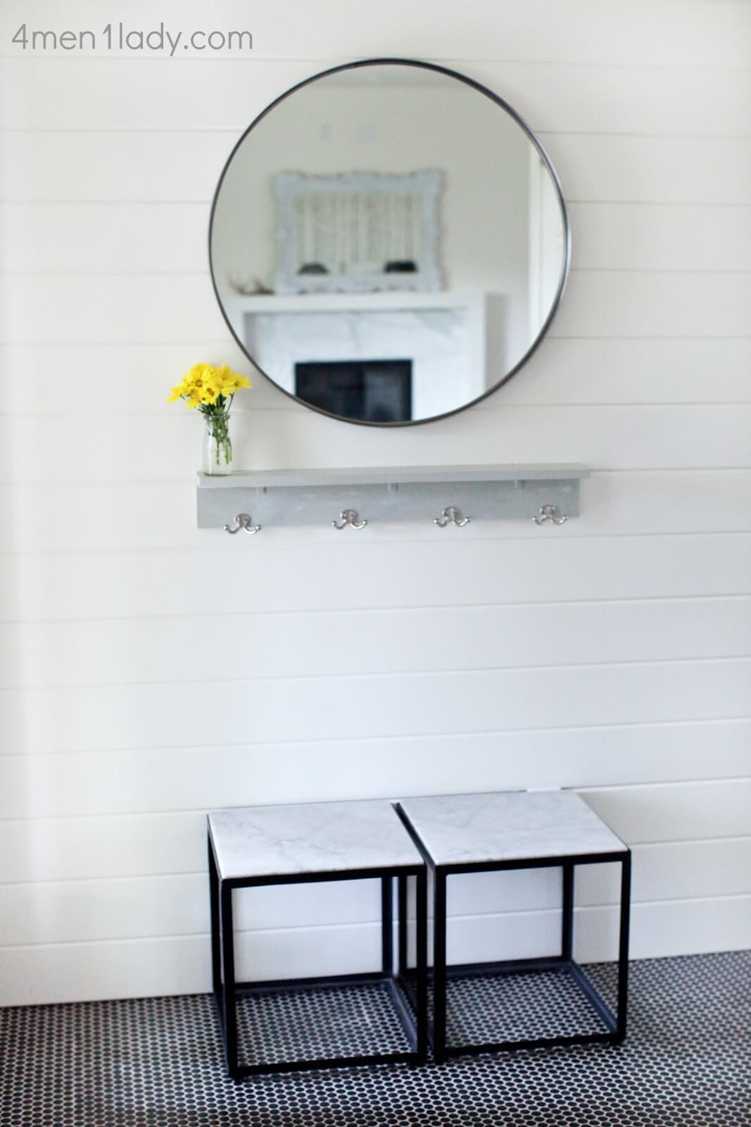 Marble and Tile Cosmopolitan Foyer with Mirror