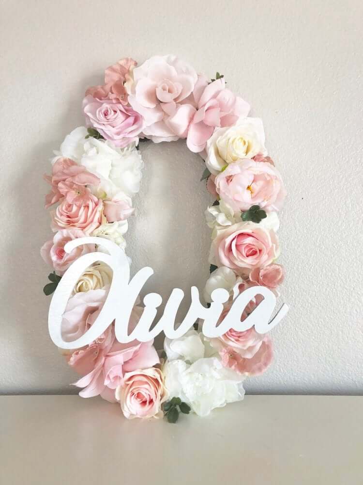 Small Wooden Name Displayed on Large Floral Initial Wall Art