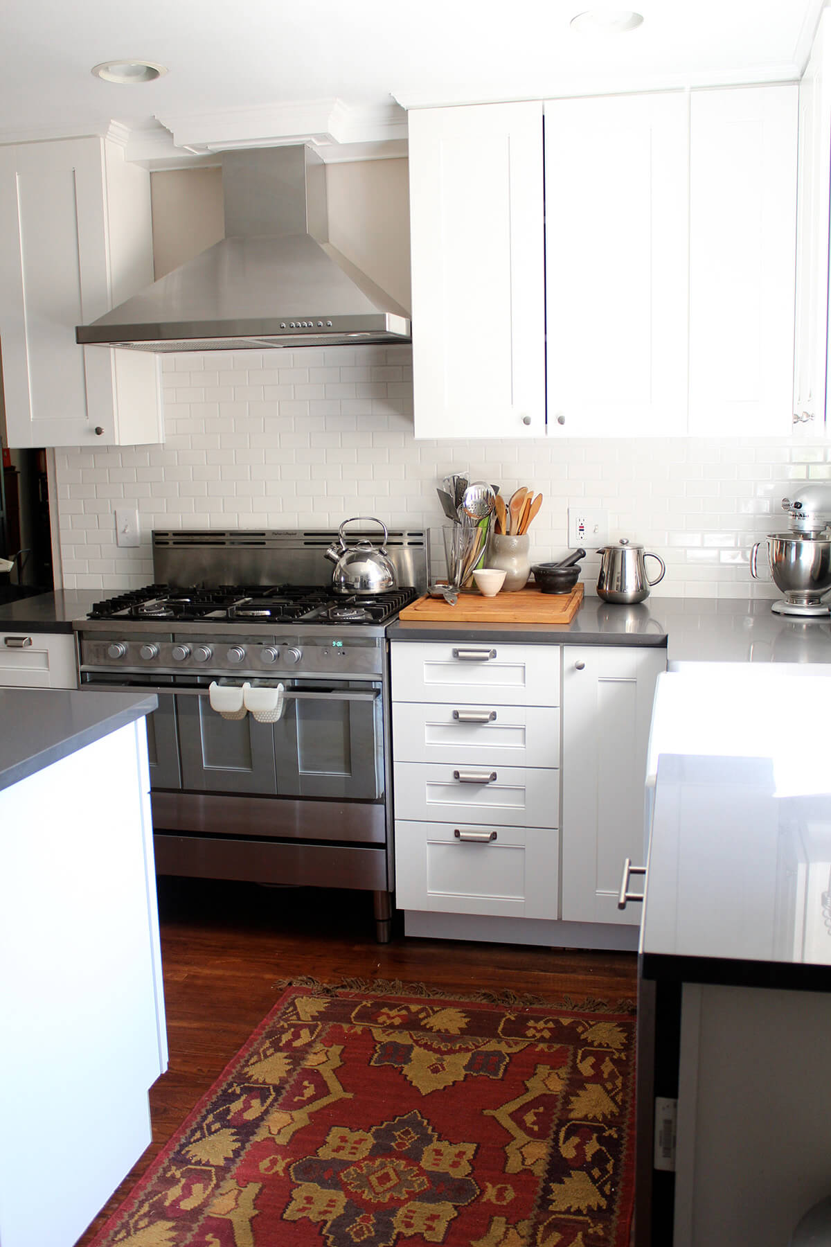 Simple White Kitchen with Turkish Rug