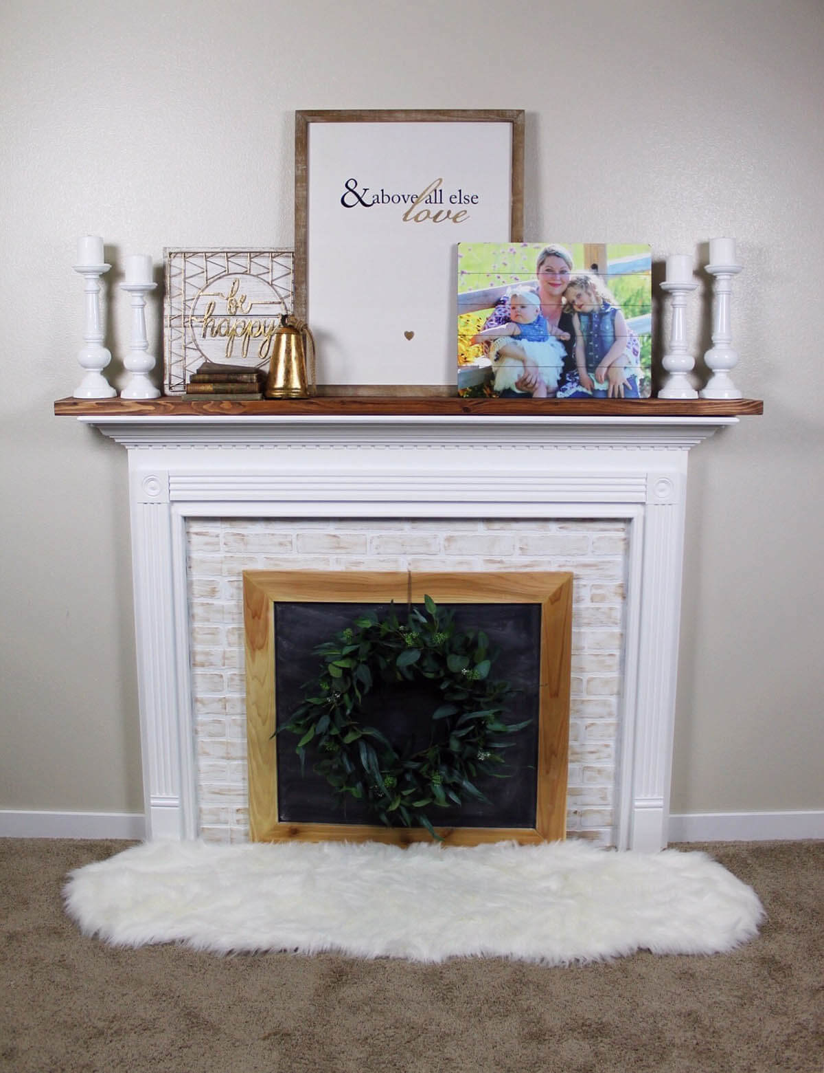 Timeless Whitewashed Brick and Wood Framed Fireplace