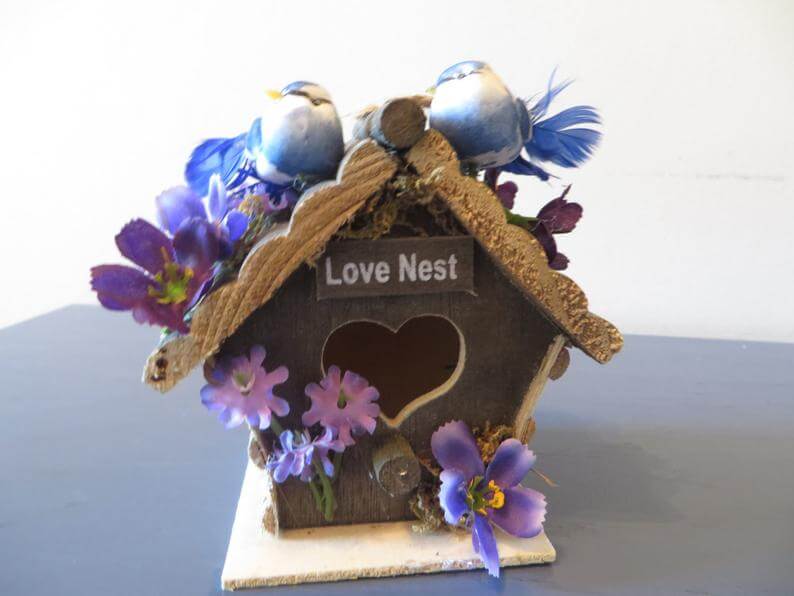 The Love Nest Featuring Two Birds in a Wooden House