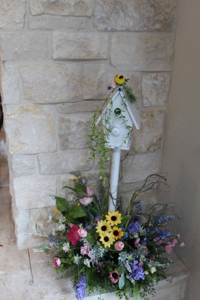 Large Arrangement with White and Yellow Flowers and Bird Nest